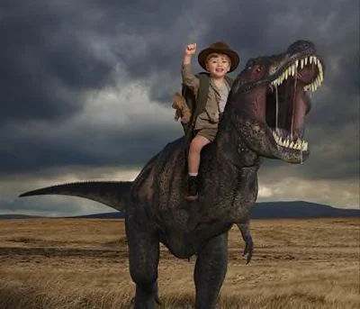 Boy Riding a T-rex Dinosaur punching the air